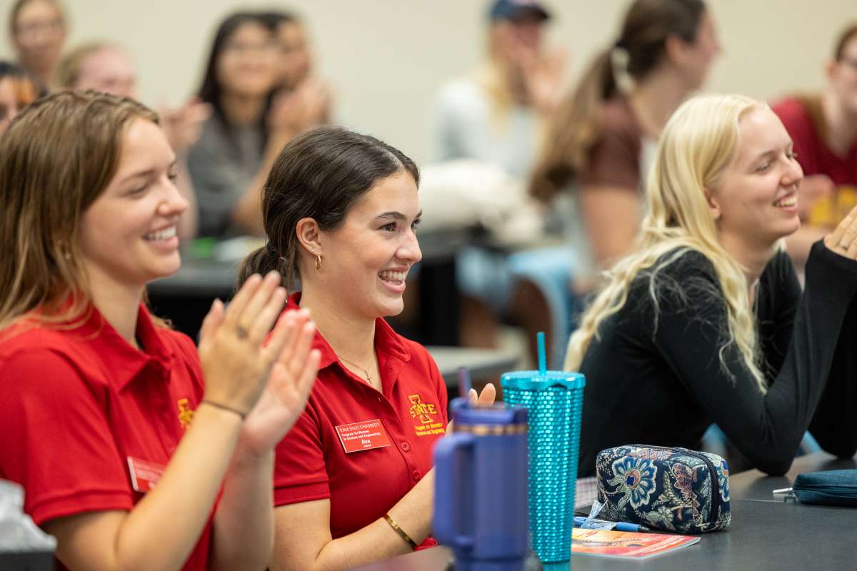 Student engaged and smiling in class